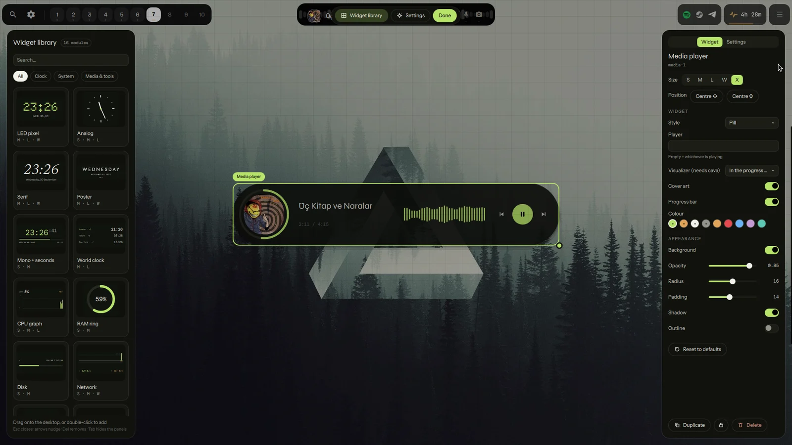 The editor: the widget library on the left, the desktop with a grid in the middle, the inspector on the right